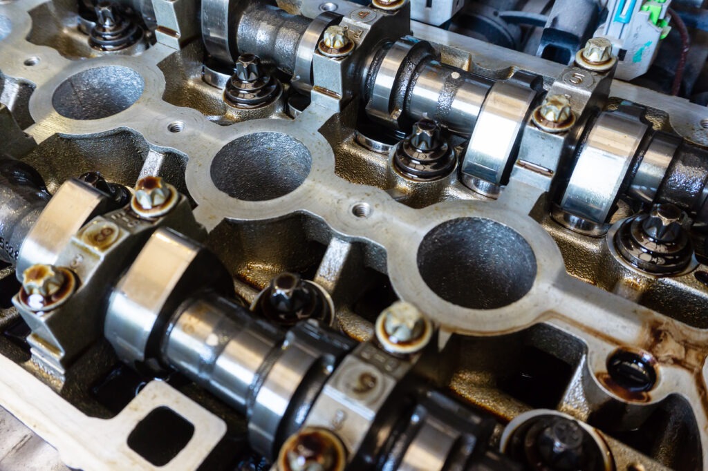 Camshafts and valve in oil on the car engine